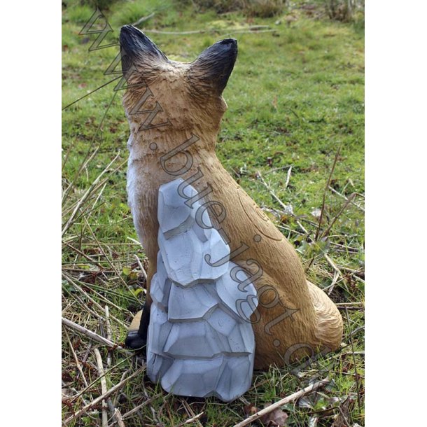 Siddende 3D Rv med klippe baggrund